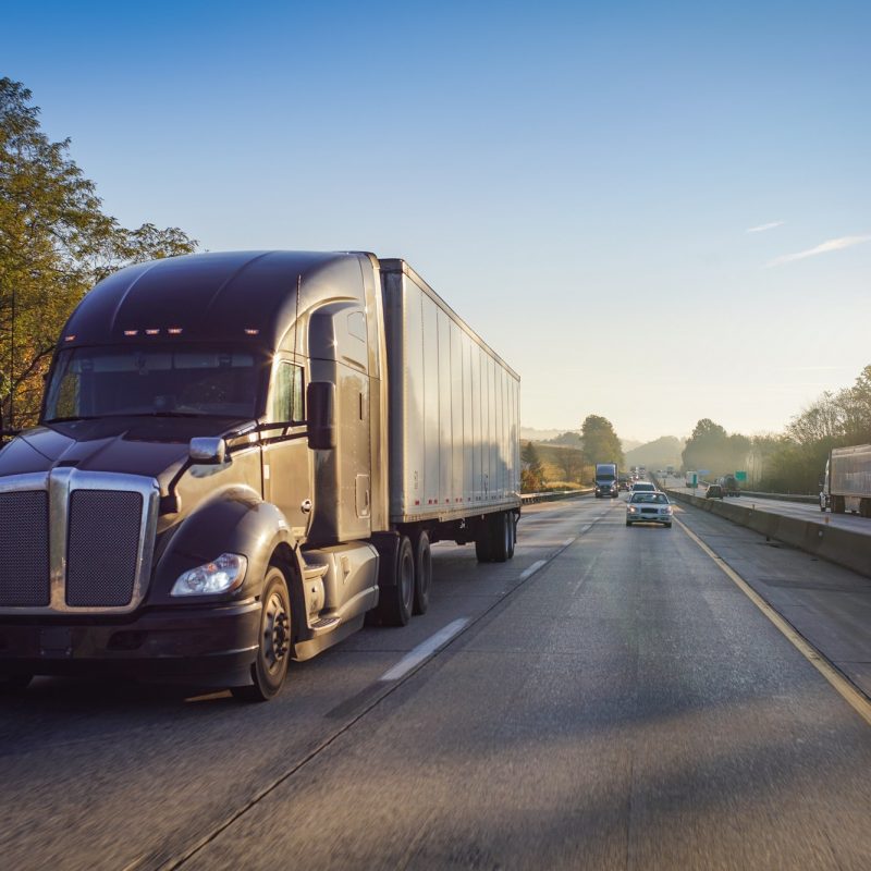 Diesel truck semi tractor trailer on the highway